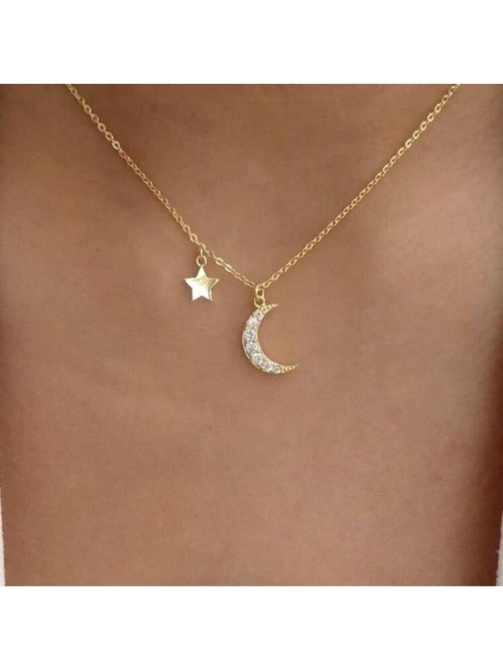 New gold tone moon and star necklace